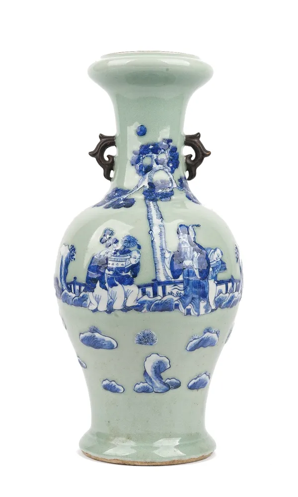 A Chinese celadon-ground blue and white two-handled vase, circa 1900,  moulded and painted with a sage and three attendants beneath a pine tree, 44.5c