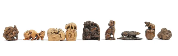 A group of eight late Japanese wood netsukes of animals, including dogs, a frog, a cat, rats  and mice, some signed; also a wood netsuke of a cicada o