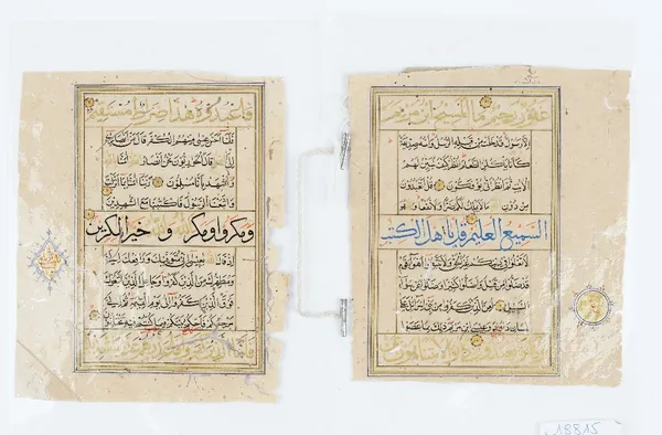 Two folios from a Quran manuscript, black and blue script with gilt and red highlights, each approx. 16cm x 13cm overall size. (2)