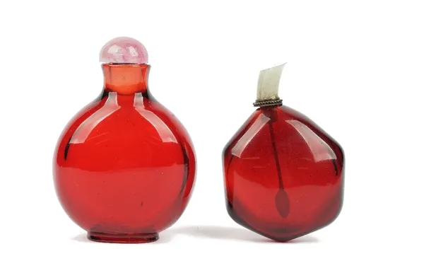 Two Chinese ruby-red glass snuff bottles, 19th/20th century, of discoidal and hexagonal form, 6cm and 4.5cm high. (2)