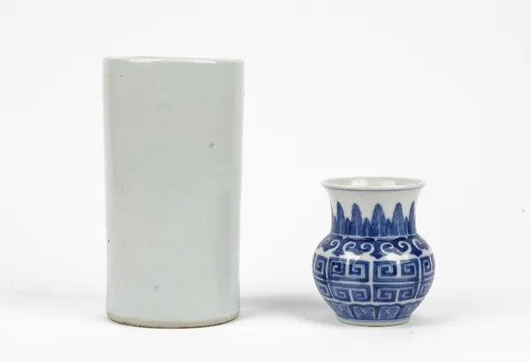 A small Chinese blue and white archaistic vase, the bulbous body painted with taotie type decoration between ruyi-head and overlapping leaf borders, a