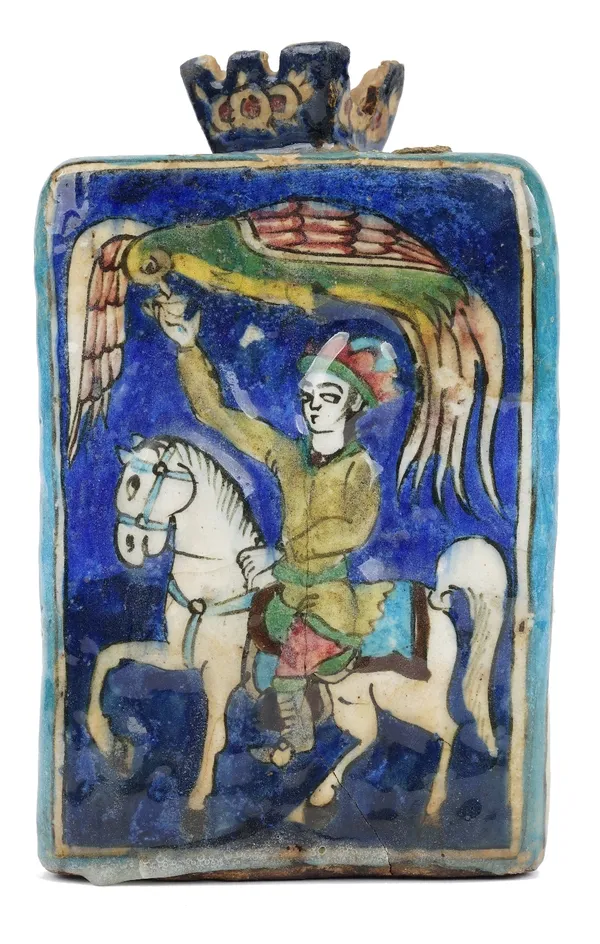 A Qajar pottery flask, late 19th/early 20th century, of triangular section, each side moulded and painted with an equestrian figure with bird, 27cm hi