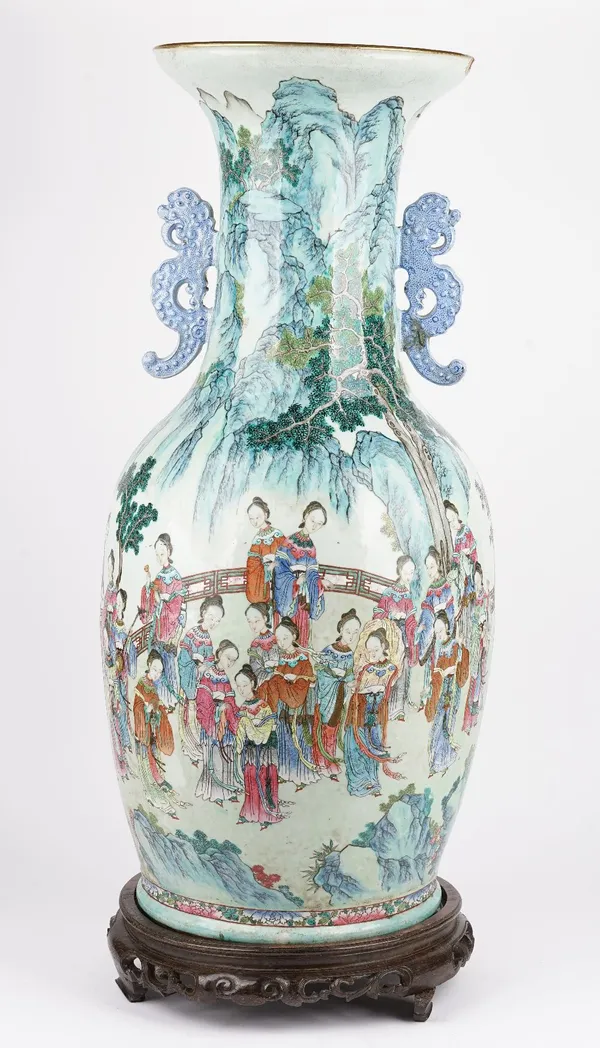 A large and impressive Chinese famille- rose two handled vase, first half 19th century, of baluster form set with blue mythical beast-shaped handles,