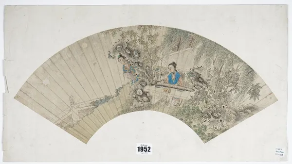 A Chinese fan painting, Qing dynasty, watercolour on paper, painted with two women in a fenced garden amongst rocks, bamboo and willow, one seated at