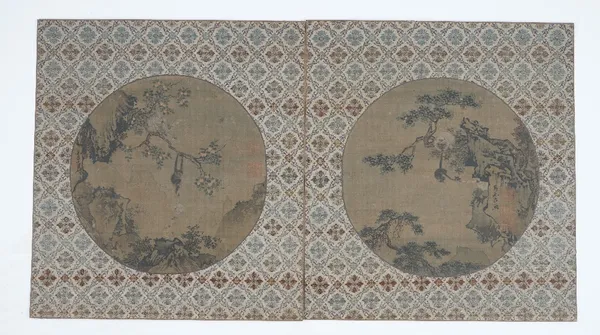 A pair of Chinese circular fan pictures, probably watercolour on a printed base on silk, each depicting monkeys amongst rocks and trees, signatures an