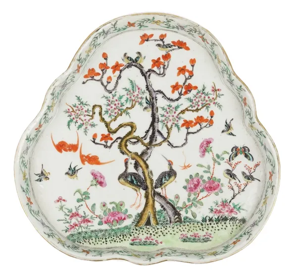 A Chinese famille rose tray, 19th century, of shaped trefoil form, painted with birds, bats and insects amongst trees and flowers, 27.5cm at widest po