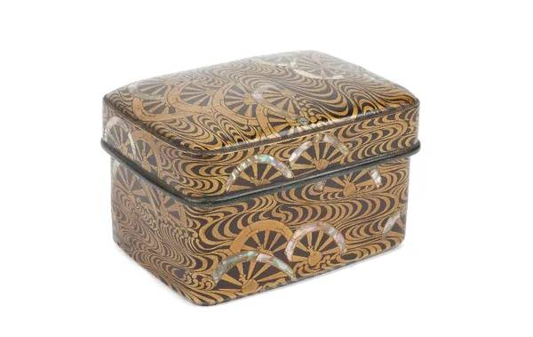 A Japanese rectangular lacquer box and cover, Meiji period, with gold lacquer wheel and scroll decoration and mother of pearl inlay to the sides and p