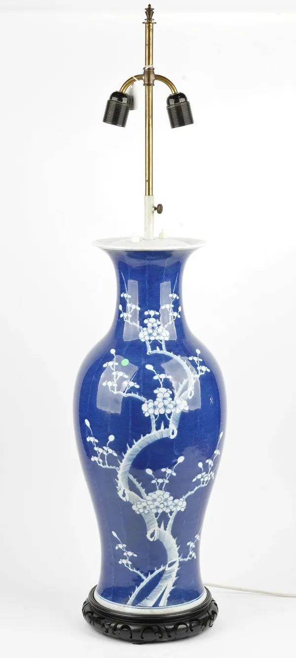 A Chinese blue and white baluster shape vase, late 19th/20th century, painted with flowering prunus, adapted as a table lamp, with carved hardwood sta