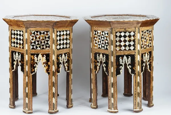 A pair of Ottoman style octagonal occasional tables, 20th century, inlaid with mother-of-pearl, the tops bearing the tughra of Sultan Abdul Hamid, 56c