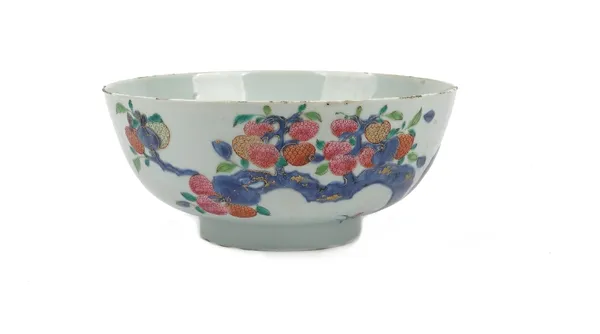 A Chinese famille rose bowl, Qianlong, painted with fruiting branches and flowers, heightened with gilding, 24cm diameter.