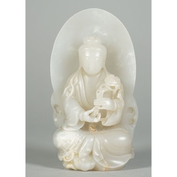 A Chinese white jade figure of Guanyin, 20th century, the goddess seated before an oval mandorla, with legs crossed and left foot resting on a lotus p