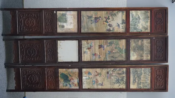 A large Chinese ten panel double-sided screen, circa 1900, each panel inset on one side with glass painted panels of luohan in landscapes between smal