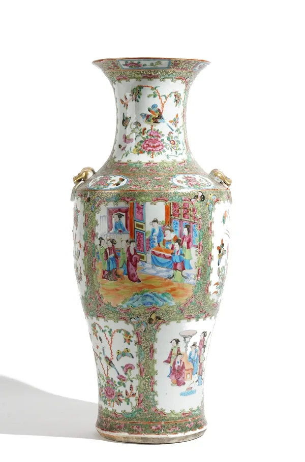 A large Canton famille-rose vase, 19th, of baluster form set with lion mask and ring handles, painted with panels of figures, birds, insects and flowe