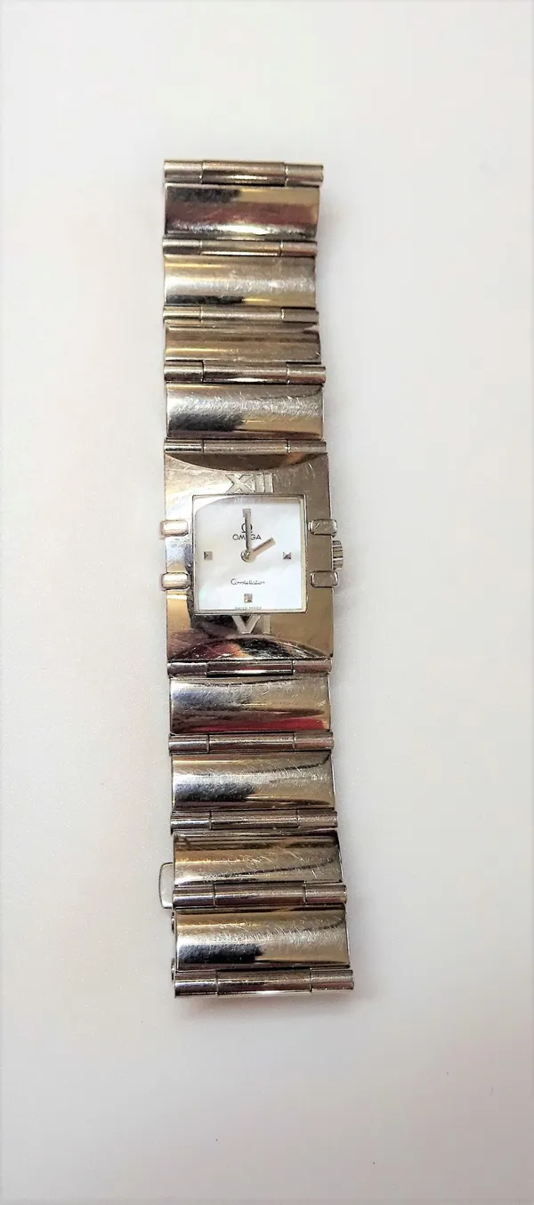 An Omega Constellation steel lady's bracelet wristwatch, the signed white dial with square dot numerals at 3, 6, 9 and 12 o'clock, the case front with