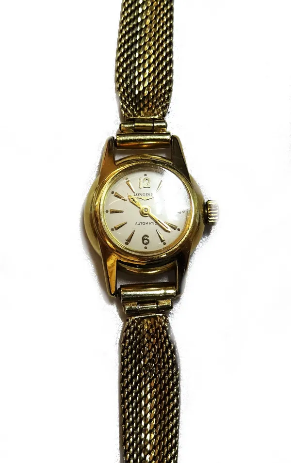 A Longines Automatic gold circular cased lady's wristwatch, with a signed jewelled movement, detailed Longines Swiss, the signed silvered dial with gi