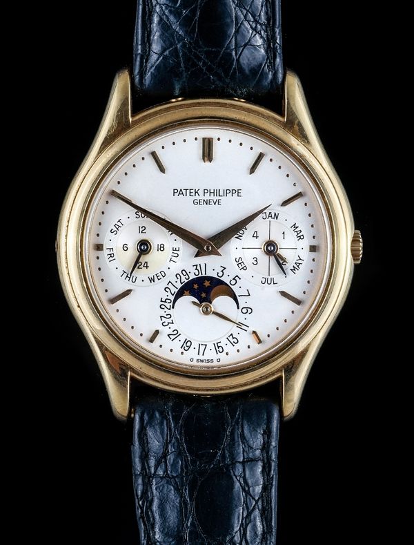 A Patek Philippe gold circular cased gentleman's calendar wristwatch, the jewelled automatic movement detailed Patek Philippe Geneve Swiss 240 Q 77162