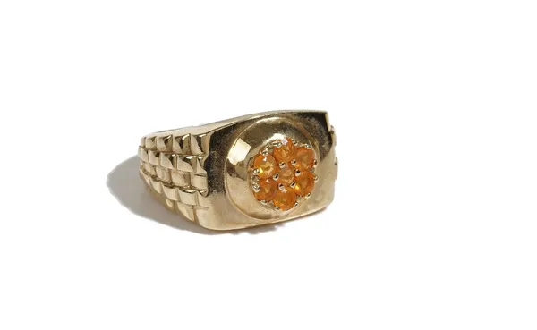 A 9ct gold and fire opal cluster ring, mounted with seven circular fire opals, between five row ridged shoulders, detailed 9 K, ring size T, gross wei