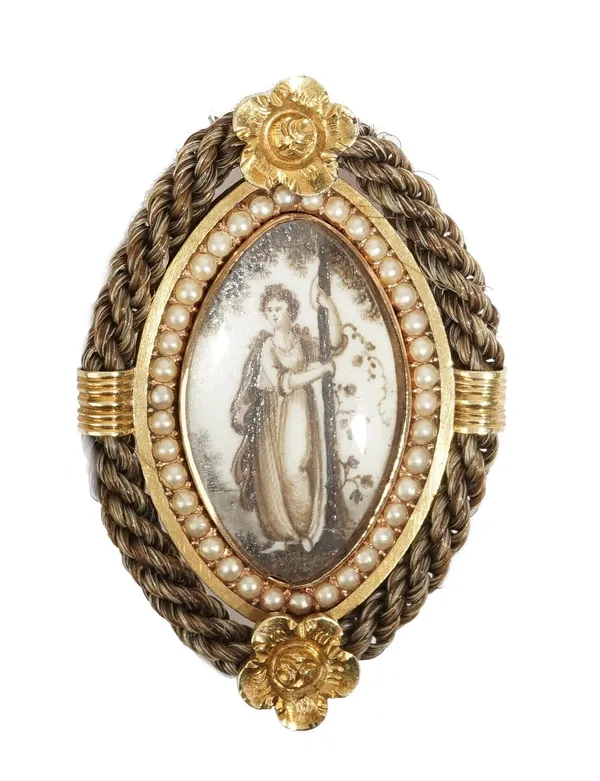 A gold, half pearl set and seed pearl mourning brooch, circa 1810-20, glazed to the centre with a sepia miniature depicting the standing figure of a l