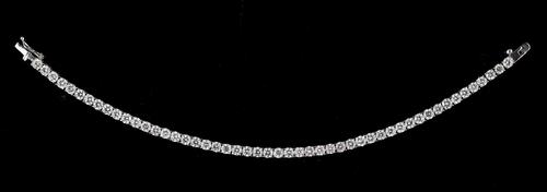 An 18ct white gold and diamond line bracelet, claw set with a row of fifty circular cut diamonds, on a snap clasp, with a foldover safety catch, lengt