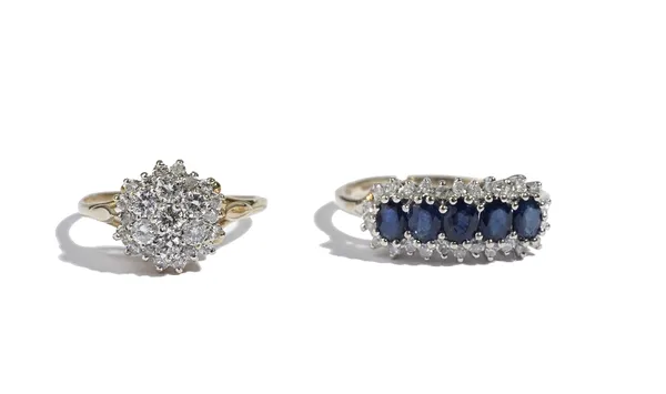 A 9 ct gold, sapphire and diamond ring, claw set with a row of five oval cut sapphires in a surround of circular cut diamonds, ring size R and an 18 c