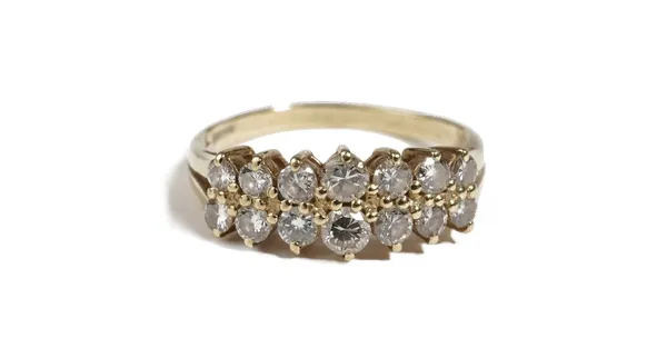 An 18ct gold and diamond ring, claw set with two rows of seven circular cut diamonds graduating in size to the centre stone, ring size P, gross weight