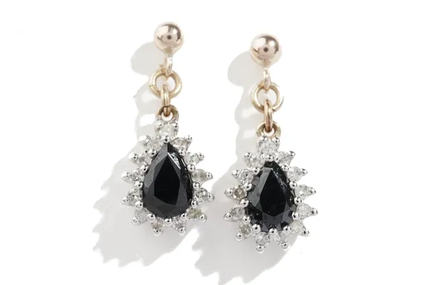 A pair of gold, sapphire and diamond pear shaped pendant cluster earrings, each claw set with the oval cut sapphire at the centre, in a surround of ci