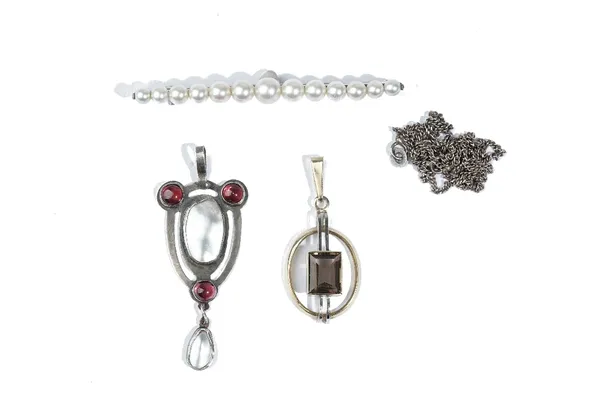 A carbuncle garnet and blister pearl pendant, in an Arts and Crafts open work design, with a silver neck chain, a 9 ct gold and smoky quartz pendant i