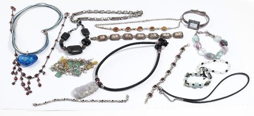 A shell cameo rectangular panel link bracelet, a watch chain, a lady's bangle wristwatch, six bracelets, two pendants with cord necklaces, a cord neck