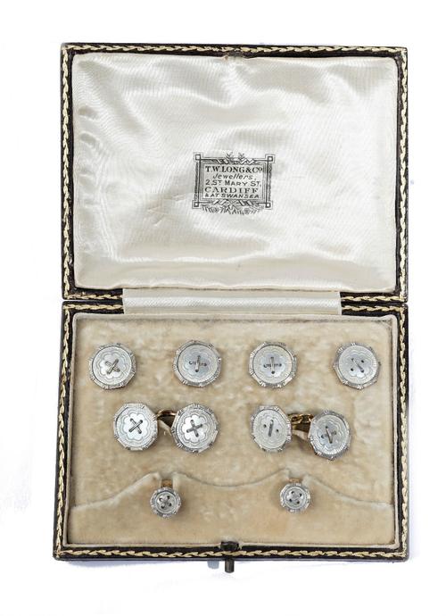 A gold and mother-of-pearl gentleman's evening wear dress set, comprising; a pair of cufflinks, a pair of studs and four buttons, each having an octag