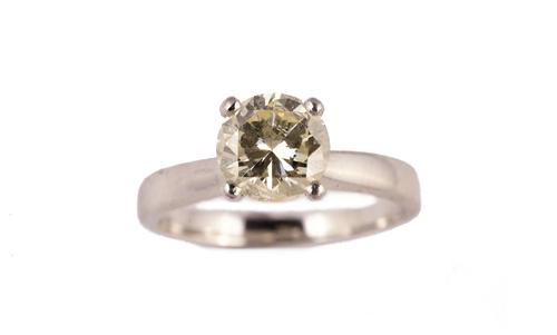 A platinum and diamond single stone ring, claw set with a circular cut diamond in a raised design, ring size L, gross weight 4.8 gms, with a case.