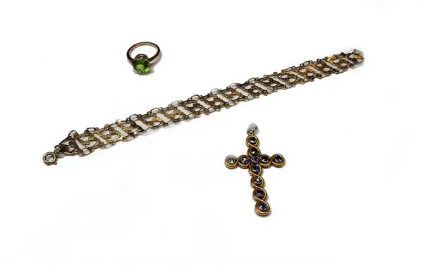 A gold and sapphire pendant cross, detailed 14 K, gross weight 4.4 gms, a gold ring, claw set with a heart shaped peridot, ring size N and a half and