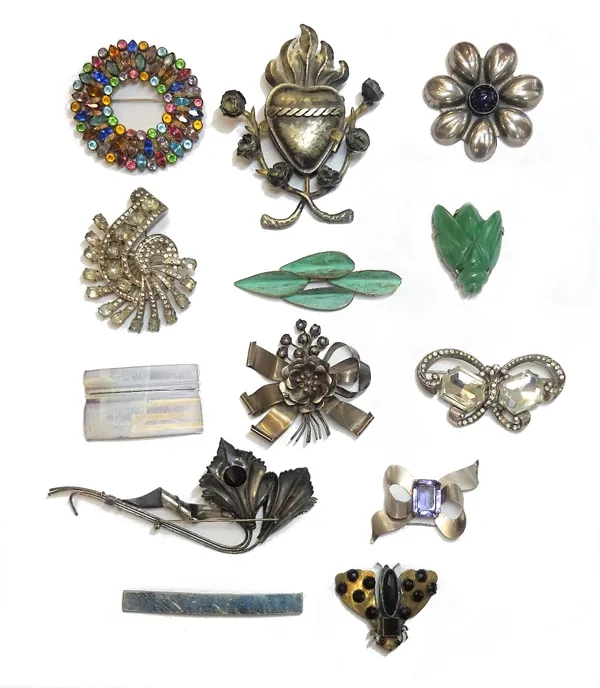 A Mexican cabochon amethyst brooch, designed as a stylized flowerhead, two colourless paste set brooches, detailed Eisenberg Original and ten further