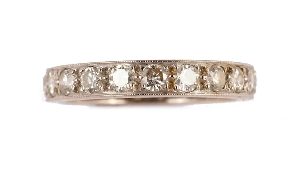 An 18ct white gold and diamond set full eternity ring, mounted with circular cut diamonds, ring size P, gross weight 4.7gms, with a case.