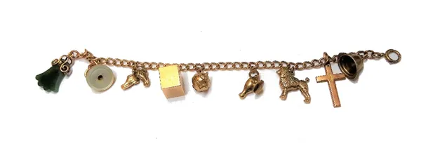 A gold curb link charm bracelet, on a boltring clasp, fitted with nine mostly 9ct gold charms, including; a poodle, a cross, an oil lamp and a teapot,