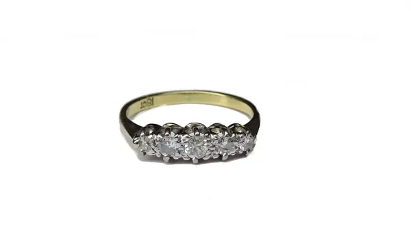 A gold and diamond set five stone ring, mounted with a row of circular cut diamonds, graduating in size to the centre stone, detailed 18 CT, ring size