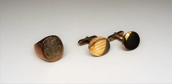 A pair of 9ct gold cufflinks, with plain oval fronts and with folding bar fittings at the backs, Birmingham 1979 and a 9ct gold oval signet ring, engr