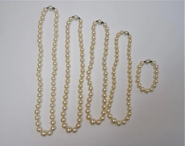 Four single row necklaces of graduated cultured pearls and one single row bracelet, of graduated cultured pearls, (5).