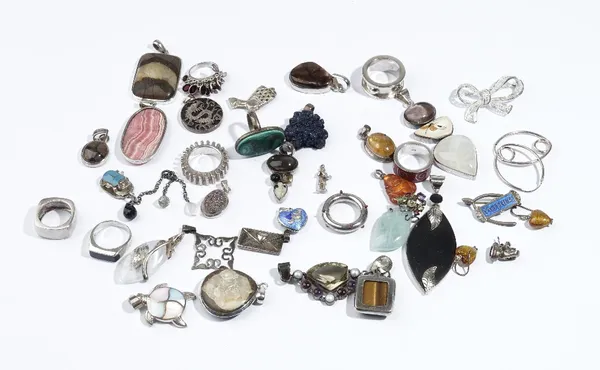 A group of mostly silver mounted jewellery, comprising; twenty-five pendants and charms, eight rings, three pairs of earrings and two brooches, (38).