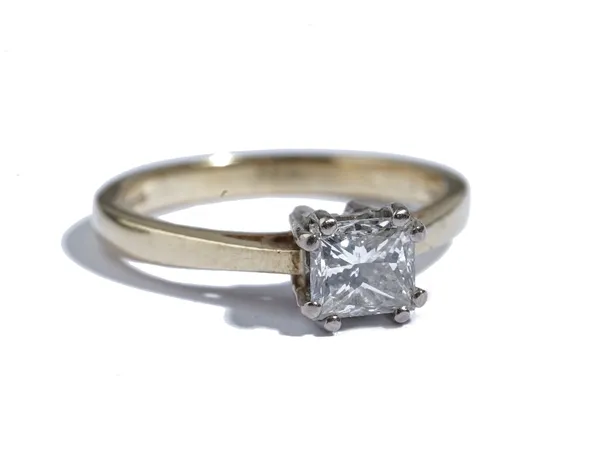 An 18ct gold and diamond single stone ring, claw set with a princess cut diamond, detailed to the shank 1.07, ring size Q and a half, gross weight 4.8