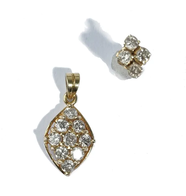 A gold and diamond nine stone pendant in a marquise shaped cluster design, mounted with circular cut diamonds, detailed 18 K 750 and one gold and diam