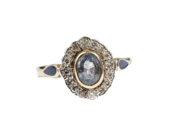 A 14ct gold, sapphire and diamond oval cluster ring, collet set with the oval cut sapphire in a surround of circular cut diamonds, between blue enamel