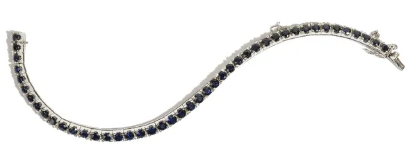 An 18ct white gold and sapphire-set line bracelet, claw-set with circular-cut sapphires, approximate total weight 8.75ct, set to square links, to a b