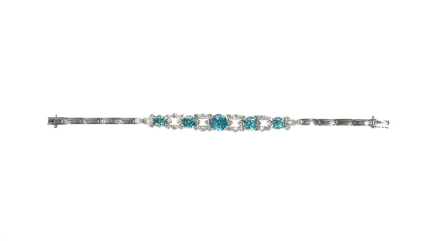 A white gold, diamond and blue zircon set bracelet, the front claw set with a row of five circular cut blue zircons, graduating in size to the centre