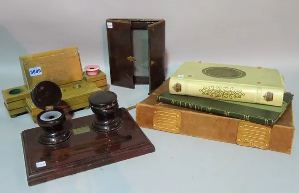 A collection of 18th century and later desk items including two ink wells, a leather travelling photograph frame and leather photograph albums, (qty).