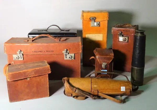 A collection of leather cased items including a brass telescope, a Rolleiflex camera, cased Ordinance Survey maps, a compass, a metal travelling art b