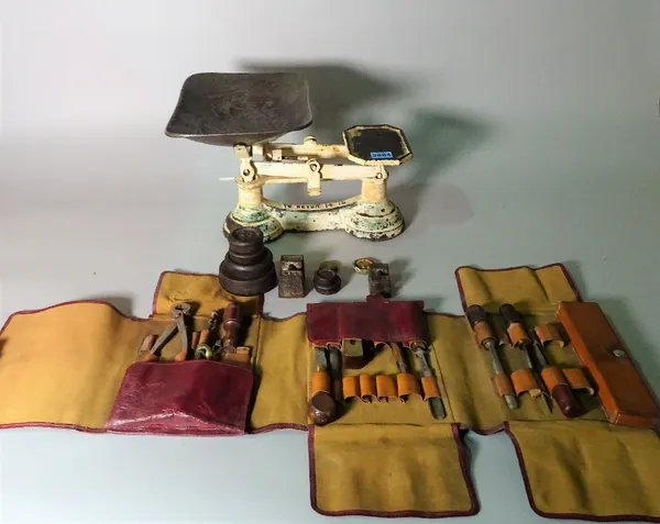 A set of Salter style weighing scales, a cased set of carpenter's tools and two wooden boxes.