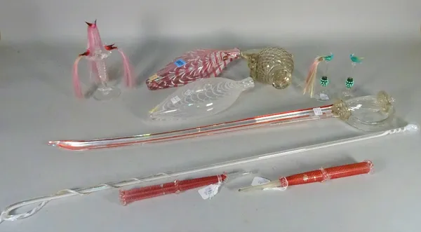 A group of Nailsea glass, 19th century, comprising; a ceremonial sword, 74.2cm long; a riding crop, 81cm long; two gimmel flasks; a pair of cigar hold