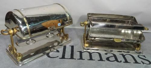 A pair of silver plated food warmers, 20th century, of domed form on a brass frame, with twin internal heating element and plinth base, 66cm wide. (2)