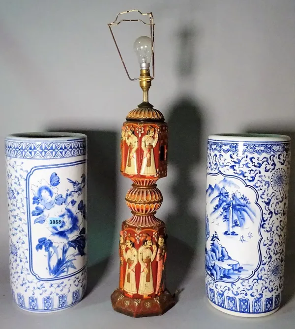 A pair of modern Asian style blue and white stick stands, 45cm high, and a carved and painted lampbase, 76cm high.