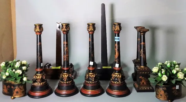 Two hardwood weighted plate stands, 45cm tall, a quantity of modern painted candlesticks, 38cm tall, together with a pair of oval lacquer jardinières,